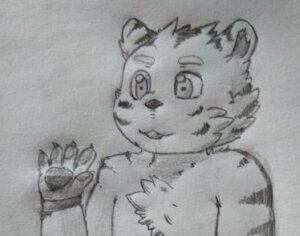 Sitting tiger cub